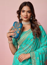 Stunning looking sea green georgette saree